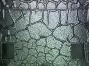 Figure 5: The “crow’s feet” appearance is indicative of solvent attack of the coating. 