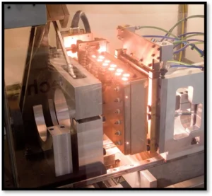 Quartz IR array with custom shielding in use for a filter welding application. Photo provided by Forward Technology.