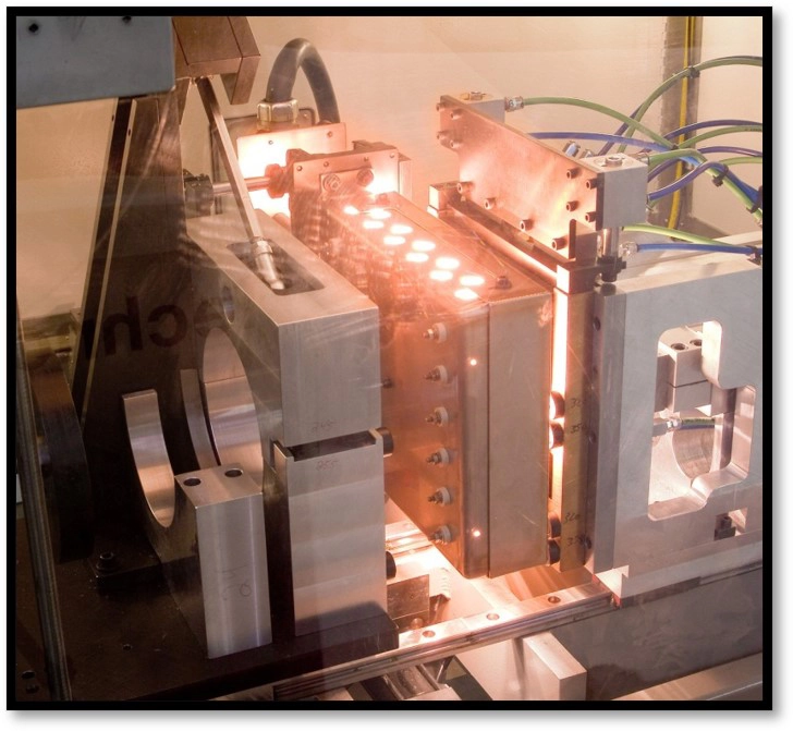 Quartz IR array with custom shielding in use for a filter welding application. Photo provided by Forward Technology.